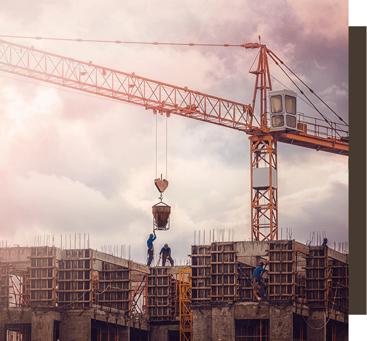 A crane is in the sky over some buildings.