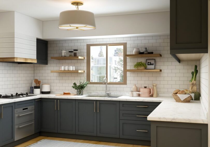 A kitchen with white cabinets and wooden floors